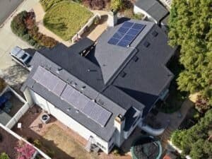 Roofing Contractor San Diego County, Richardson Roofing. Solar panels were removed prior to roof replacement and then reinstalled after the asphalt shingles were completely installed.