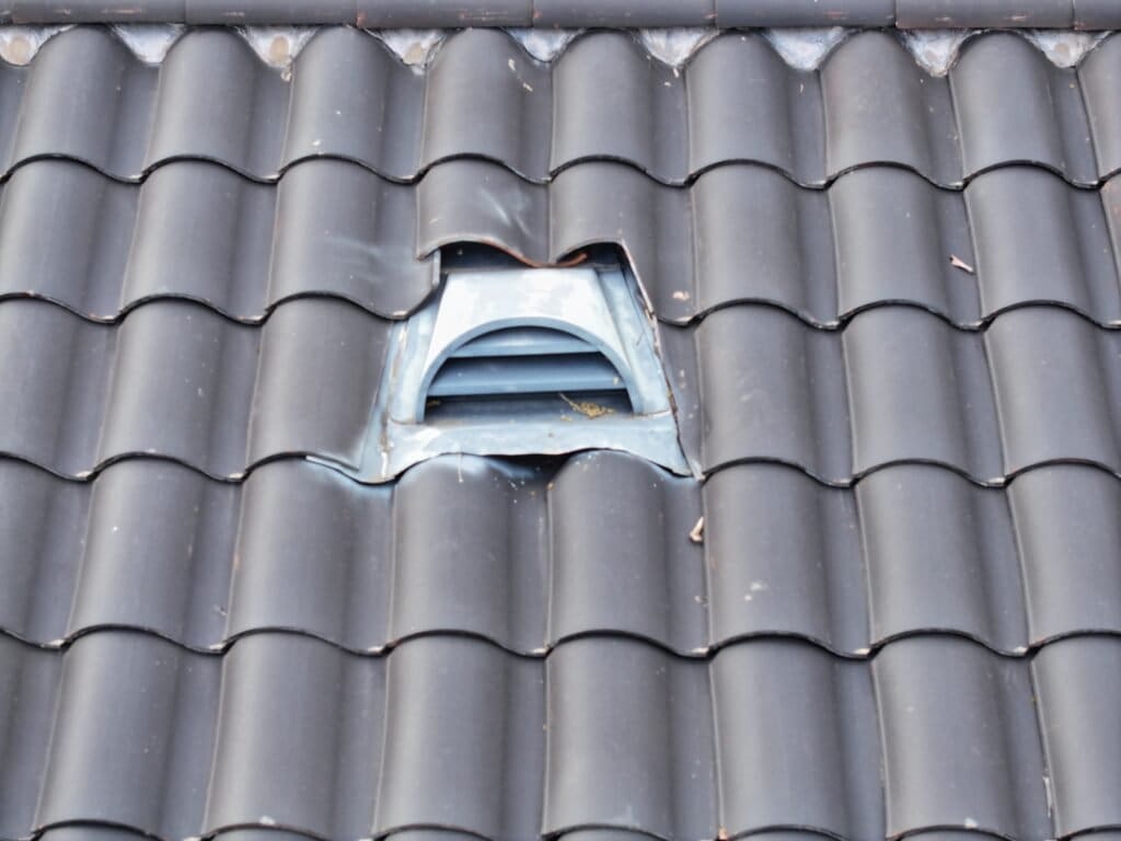 Roof Inspection on Passiflora Avenue, Encinitas, CA Soft aluminum flanges on dormers were not installed. Water leaks under roof tiles.