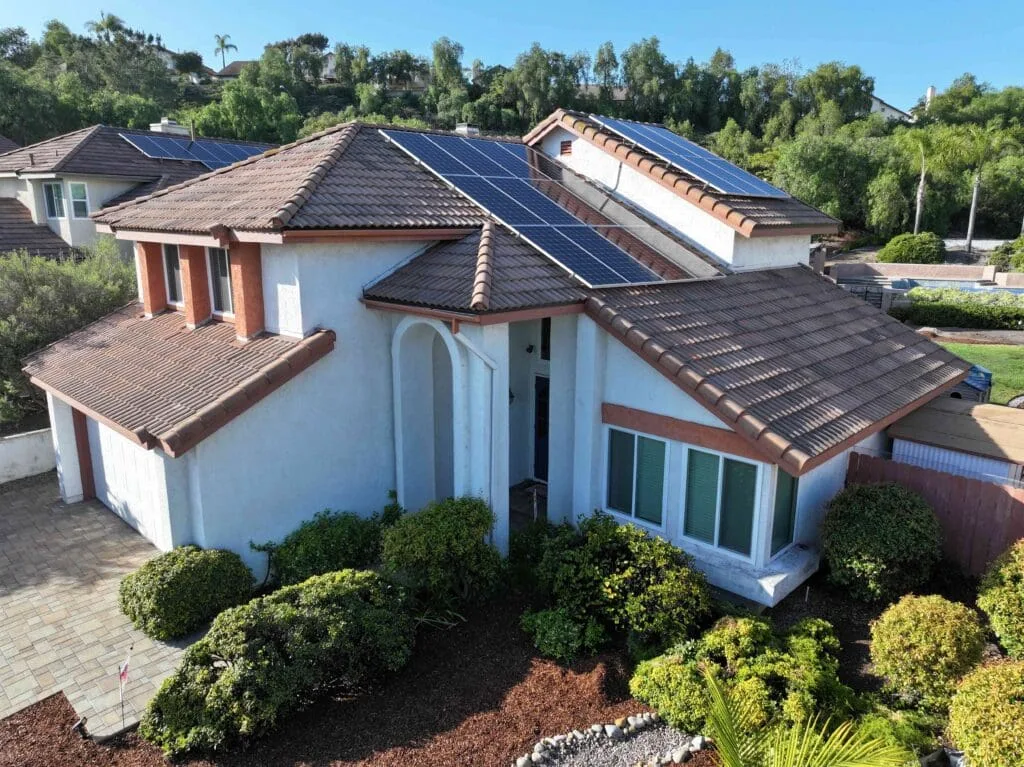 This house was reroofed by Richardson Roofing. It is a concrete Villa tile with solar panels located in Rancho Penesquitos, San Diego. This is the view from the front.