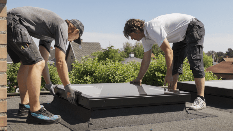 Roofing Contractor 4S Ranch Installing Velux skylight on a flat roof.