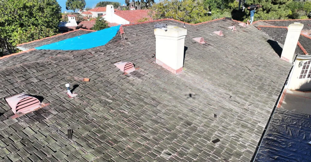Richardson Roofing Starting phase of a roof replacement in La Jolla featuring wood shake removal by San Diego County roofing company Richardson Roofing.