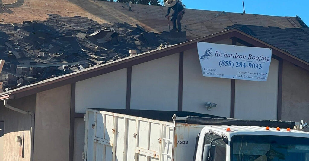 The Richardson Roofing crew removing old roofing materials during a residential roof replacement project.