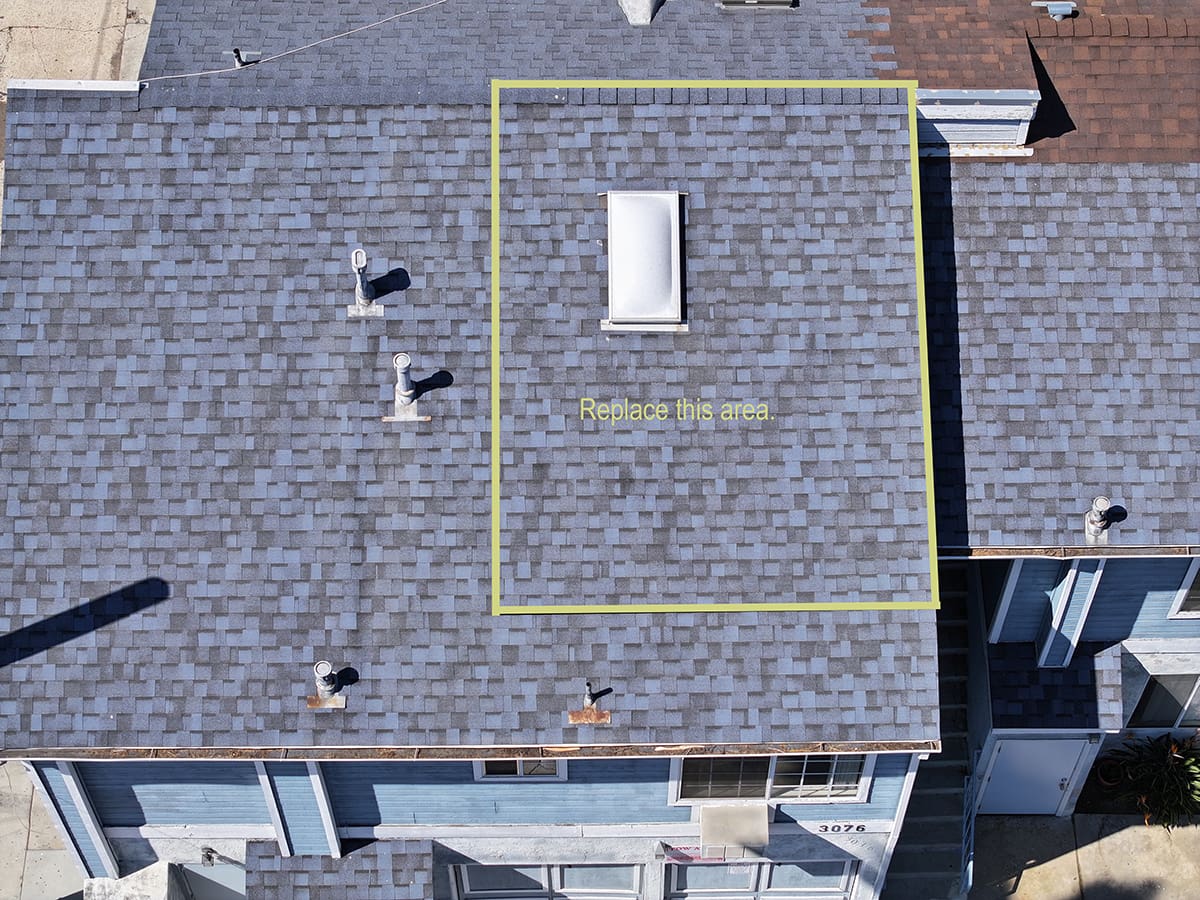 Proposed apartment building shingle roof leak repair around skylight in North Park San Diego by Richardson Roofing.